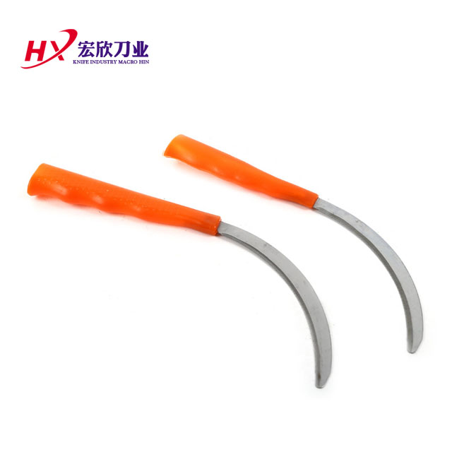 Red plastic handle  serrated  sickle