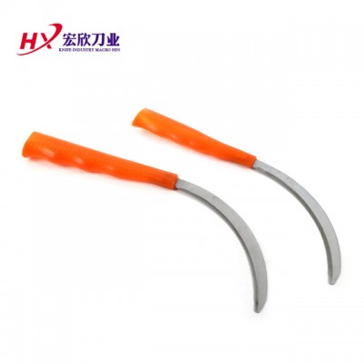 Red plastic handle  serrated  sickle